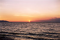 Sunrise at Baikal. The Island of Olkhon on the left.