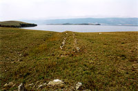 The remains of a stone wall on Cape Shara Shulun. Olkhon's north coast.